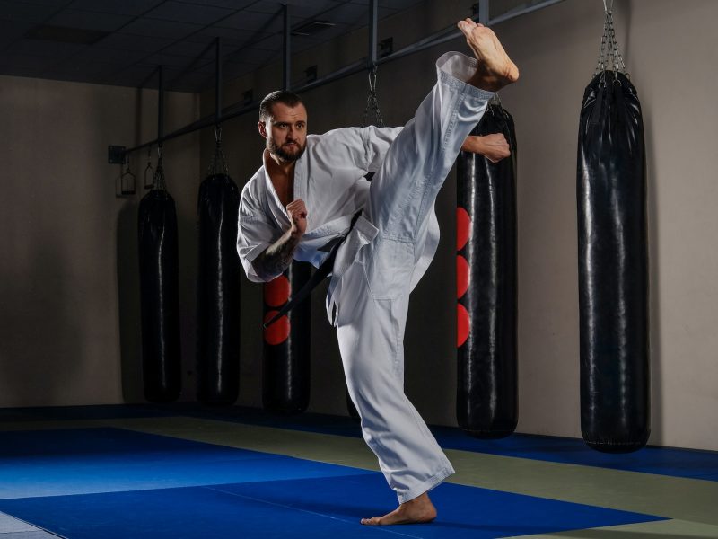 Karate fighter practicing martial arts in a fight club